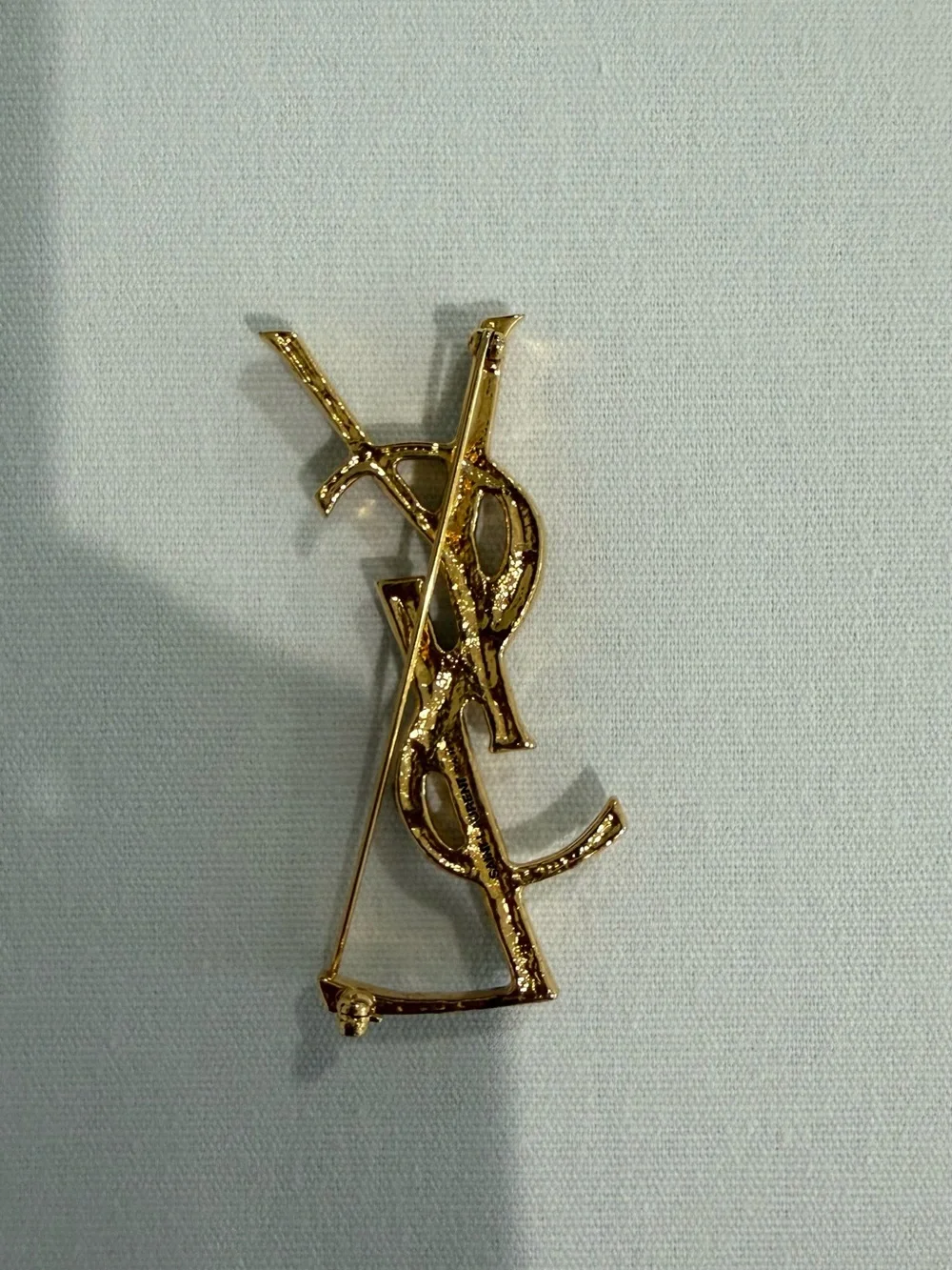 Saint Laurent Goldtone Textured Logo Brooch